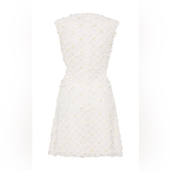 Stunning ivory white open cutting out with delicate flowers cute detailing. - Picture 15 of 16